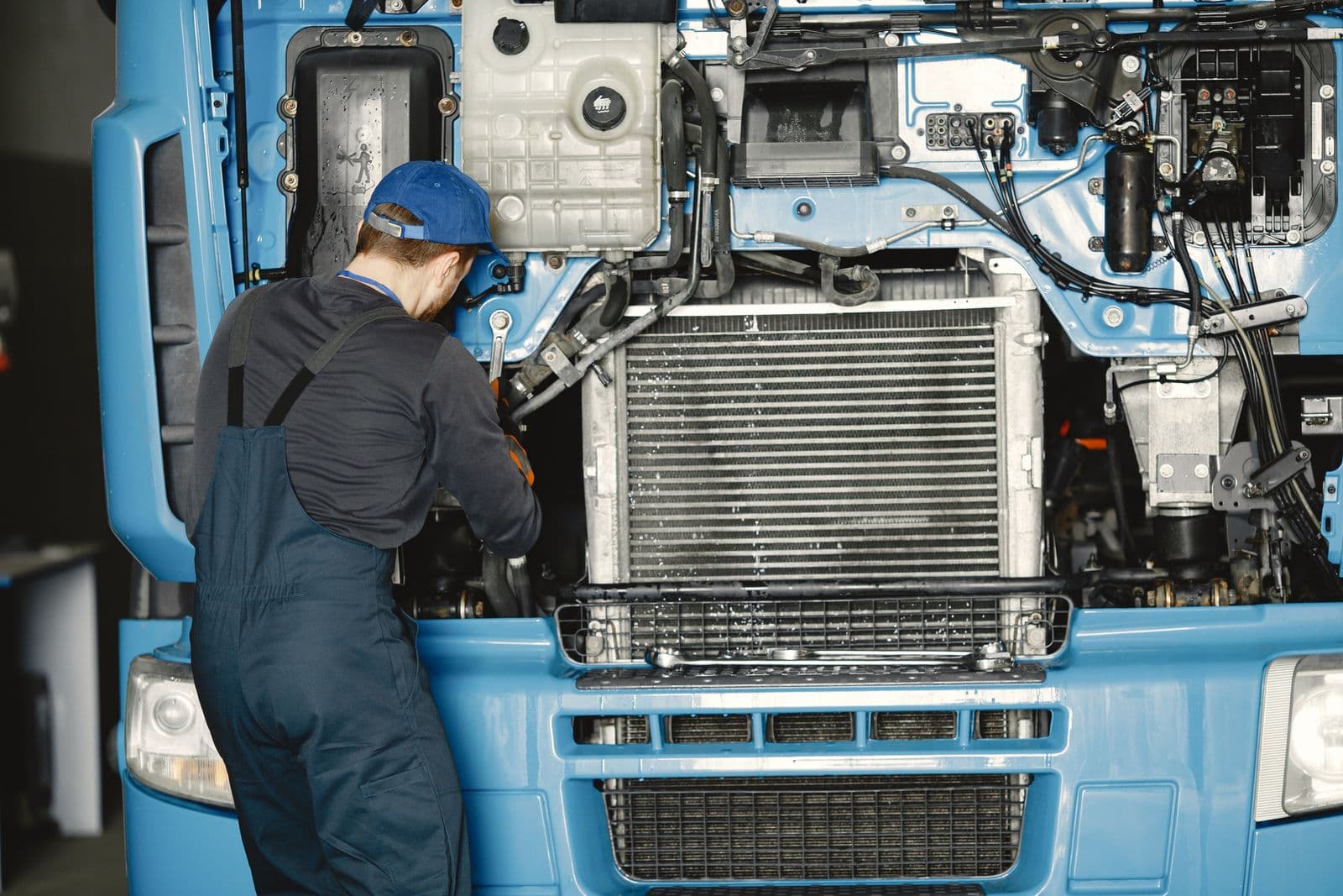 Forge technician working on heavy equipment